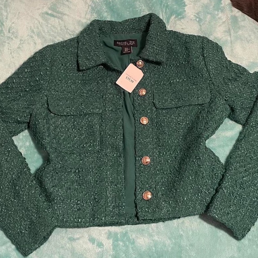 Green suit jacket, unworn, tag intact